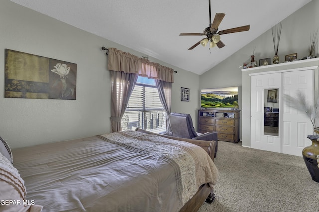 bedroom with ceiling fan, vaulted ceiling, and carpet flooring