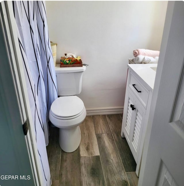 bathroom with toilet and vanity