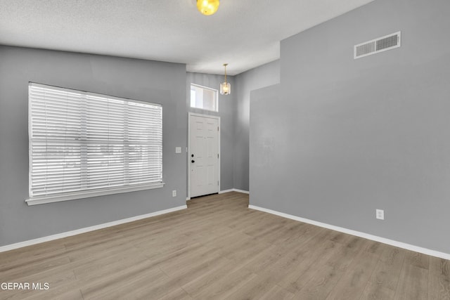 entrance foyer with light hardwood / wood-style floors