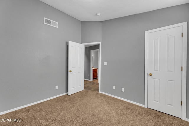 unfurnished bedroom featuring carpet