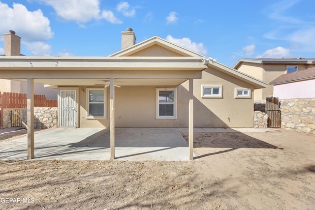 back of house featuring a patio area and ceiling fan