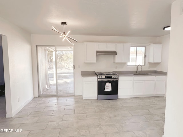 kitchen with white cabinetry, stainless steel range with gas cooktop, an inviting chandelier, and sink