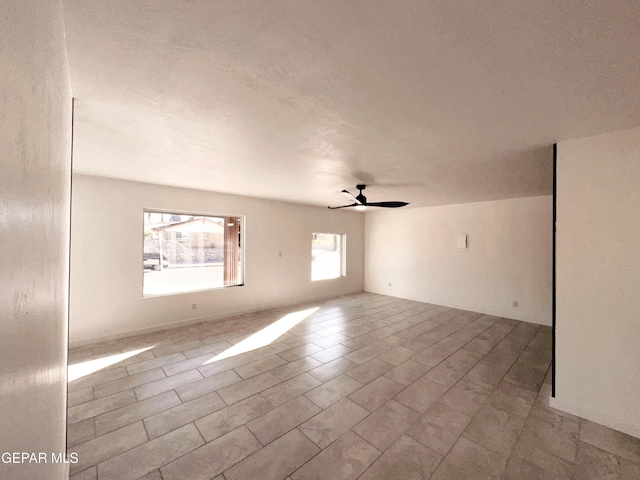 spare room featuring ceiling fan