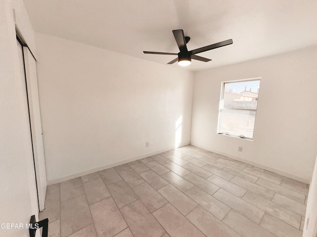 empty room featuring ceiling fan