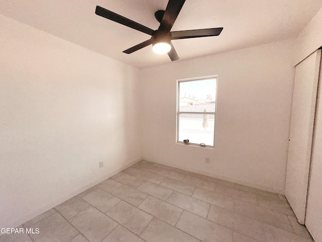 unfurnished room with ceiling fan