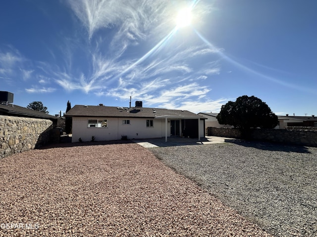 back of property with a patio area