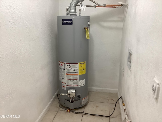 utility room featuring water heater