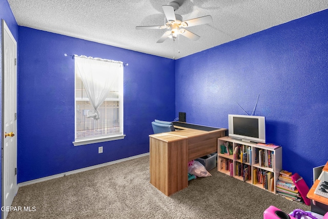 home office with ceiling fan, a textured ceiling, and carpet flooring