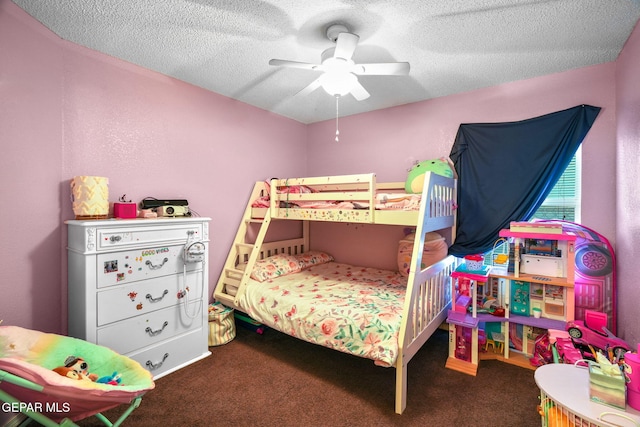 bedroom with a textured ceiling, ceiling fan, and dark carpet