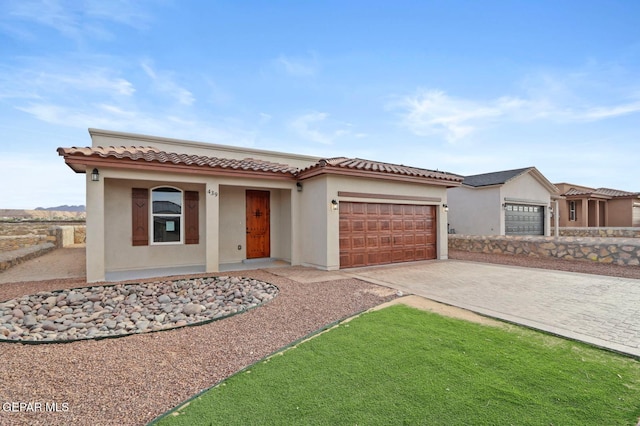 mediterranean / spanish-style house featuring a garage