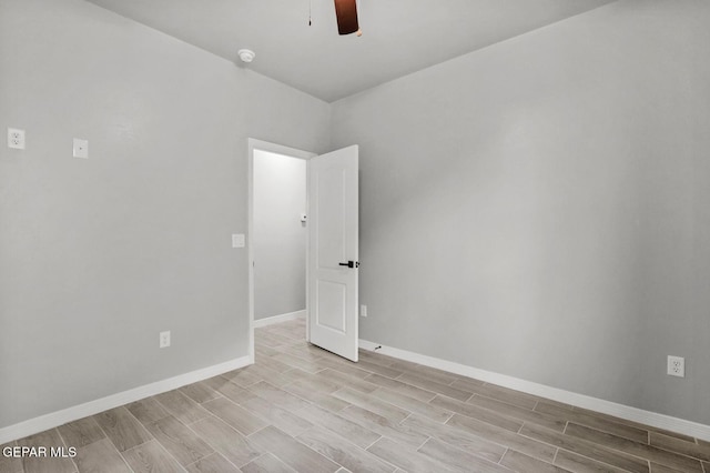 spare room featuring ceiling fan and light wood-type flooring