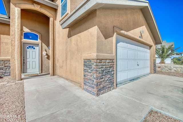 entrance to property featuring a garage