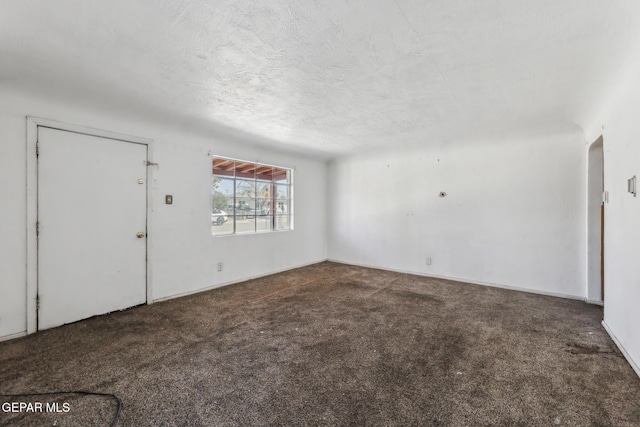 interior space with dark colored carpet