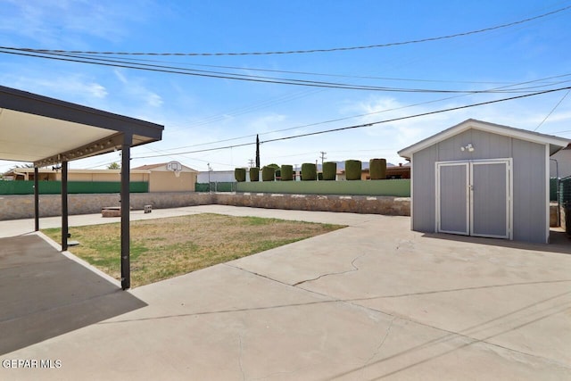 view of patio with a shed