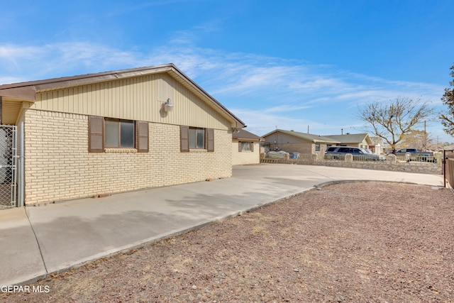 view of side of property with a patio