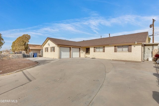 ranch-style house featuring a garage