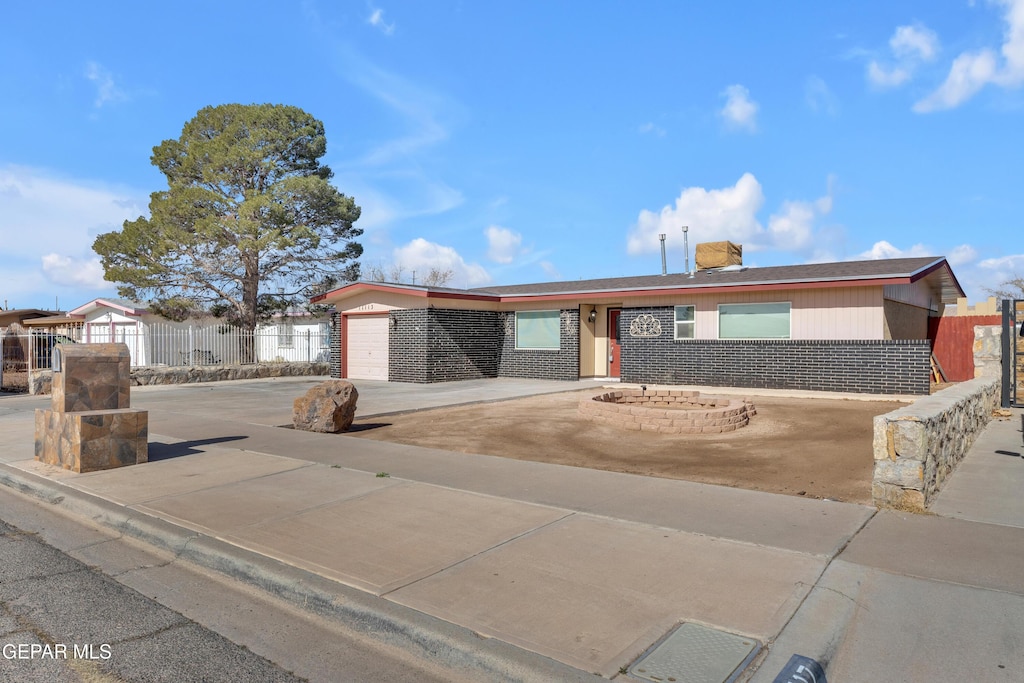 ranch-style home with a garage