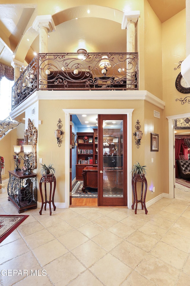 interior space with a high ceiling and ornate columns