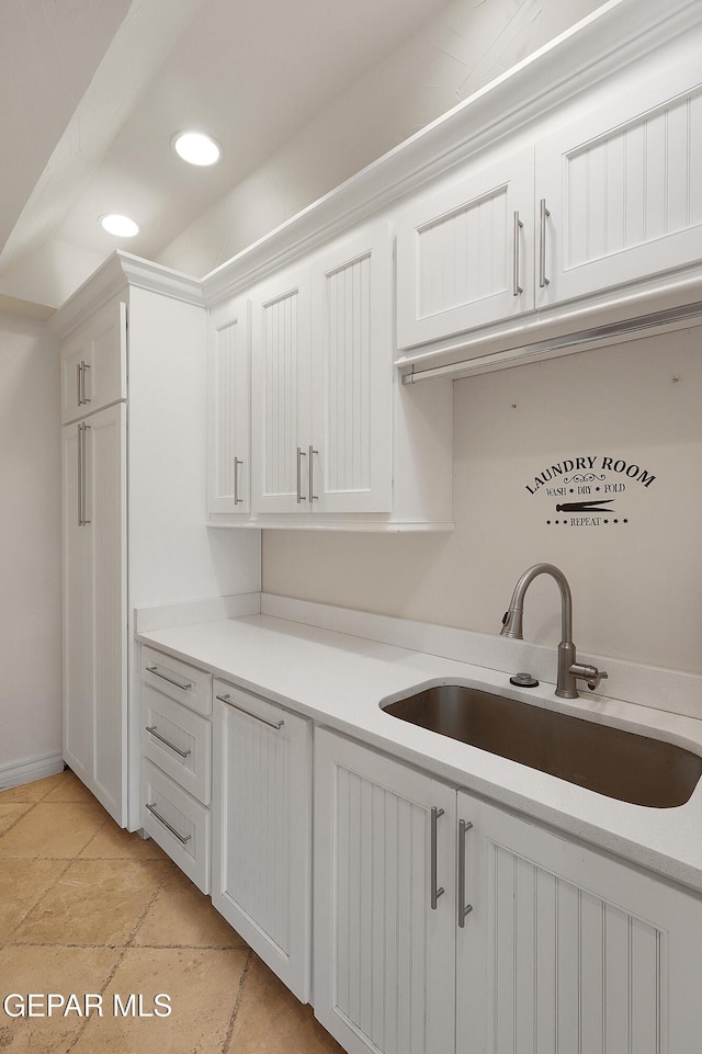 kitchen with sink and white cabinets