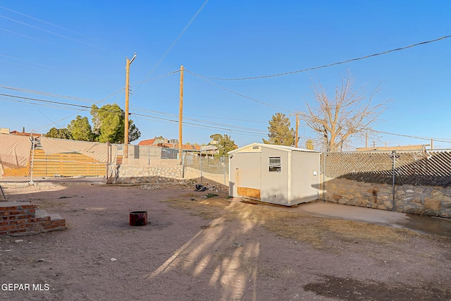 exterior space with a storage shed