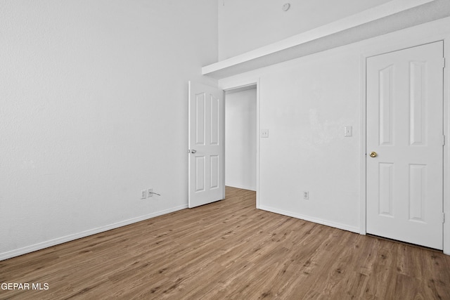 empty room with light hardwood / wood-style floors