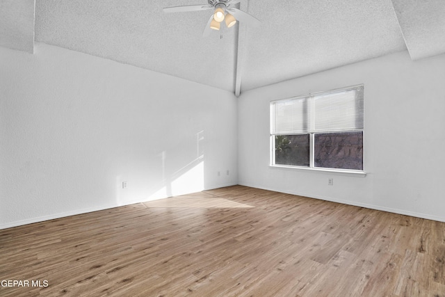 empty room featuring ceiling fan, a textured ceiling, and light hardwood / wood-style flooring