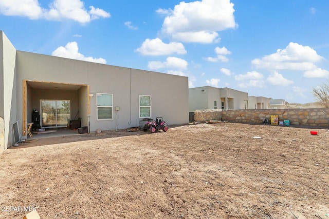 back of property featuring a patio area