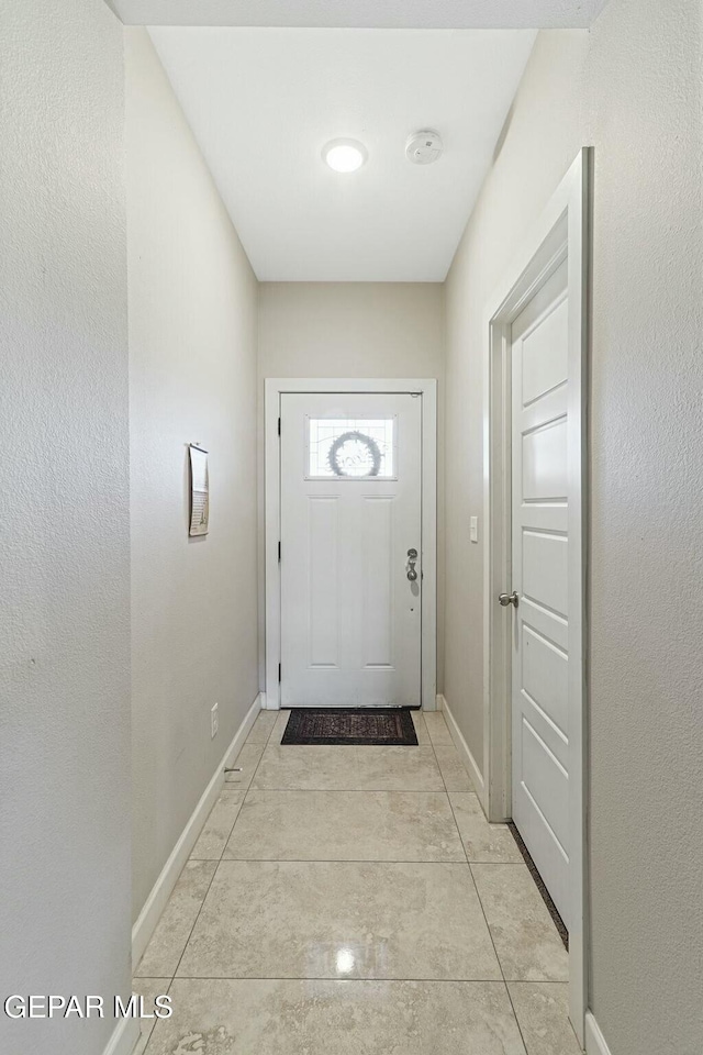 doorway featuring light tile patterned floors