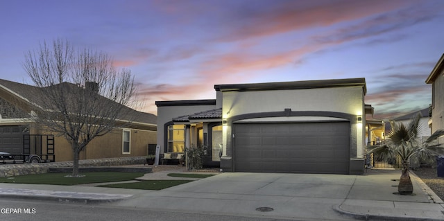 view of front of property with a garage