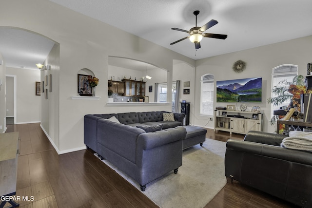 living room featuring hardwood / wood-style flooring and ceiling fan