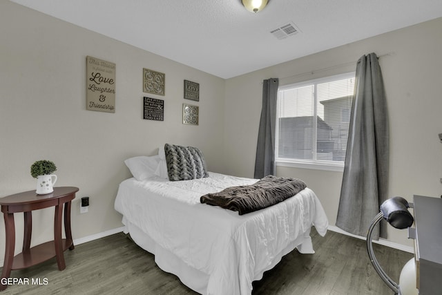 bedroom featuring dark wood-type flooring