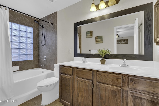 full bathroom featuring vanity, tile patterned flooring, toilet, and shower / bath combo with shower curtain