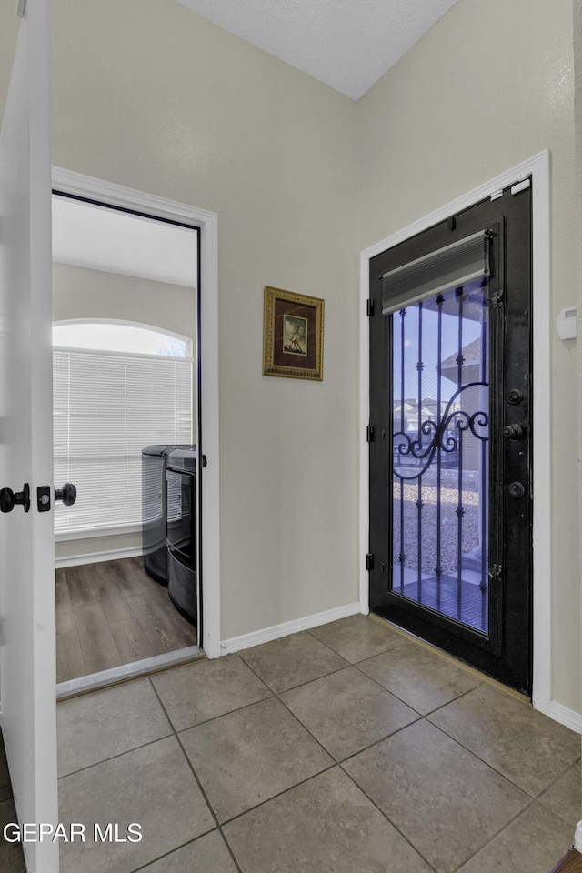 foyer entrance featuring tile patterned floors