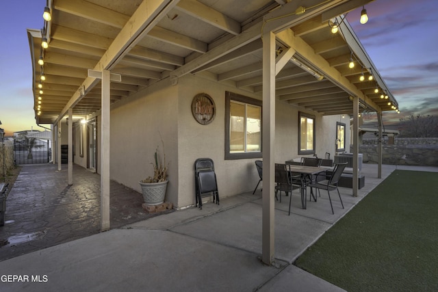 view of patio terrace at dusk