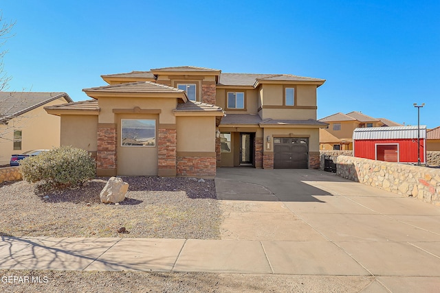 prairie-style house featuring stucco siding, stone siding, concrete driveway, a garage, and a tiled roof