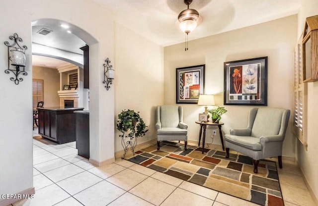 sitting room with tile patterned floors