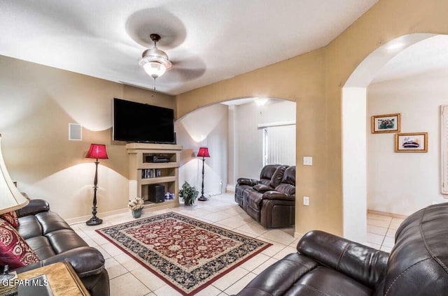 living room with ceiling fan and light tile patterned floors