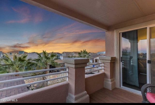 view of balcony at dusk