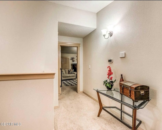 hallway featuring carpet flooring