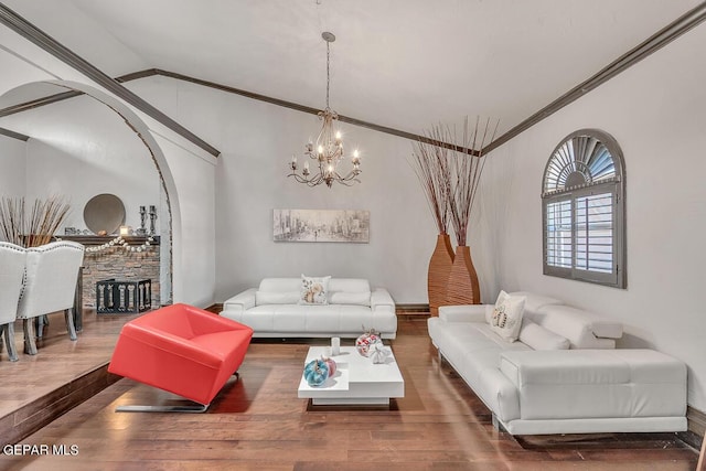 living room featuring crown molding, lofted ceiling, and hardwood / wood-style flooring