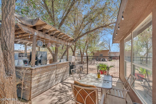 view of patio with exterior bar