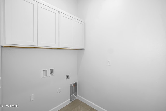 washroom featuring cabinets, washer hookup, hookup for an electric dryer, and hookup for a gas dryer