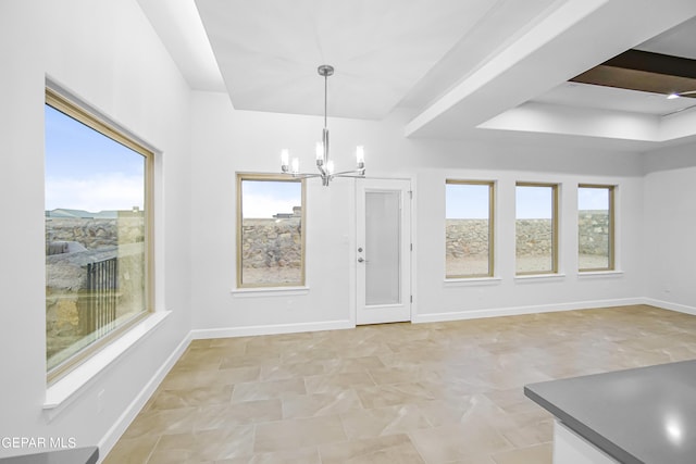 unfurnished dining area with a notable chandelier