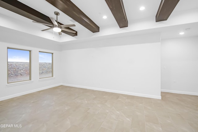 empty room featuring beamed ceiling and ceiling fan