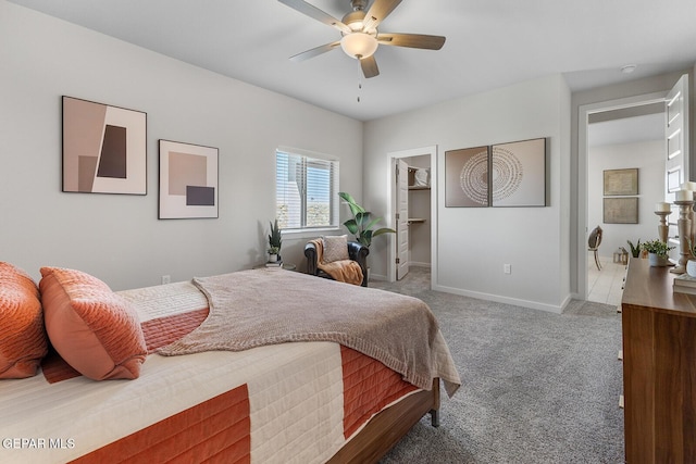 1022 Callie Ct, Socorro, TX 79927 - bedroom with carpet, a spacious closet, baseboards, and ceiling fan