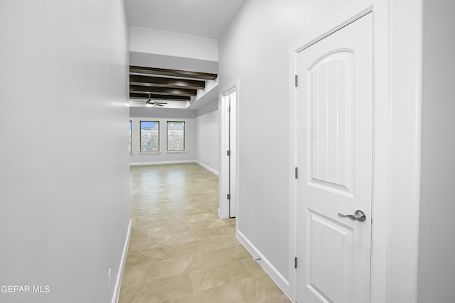 corridor featuring beam ceiling