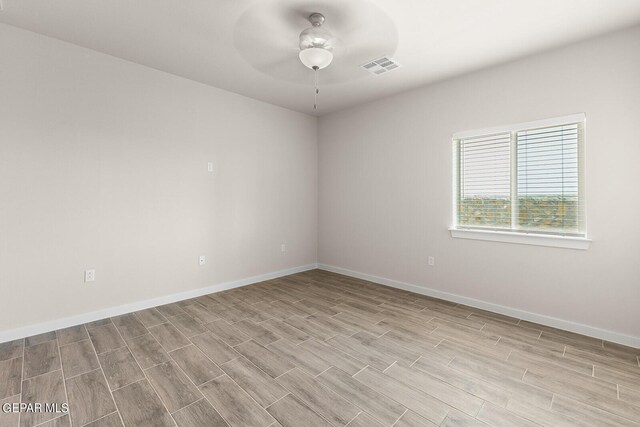 unfurnished room featuring light hardwood / wood-style floors and ceiling fan