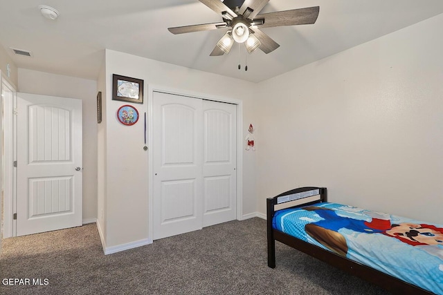 carpeted bedroom with ceiling fan and a closet