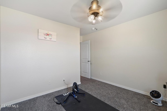 exercise room featuring ceiling fan and carpet flooring