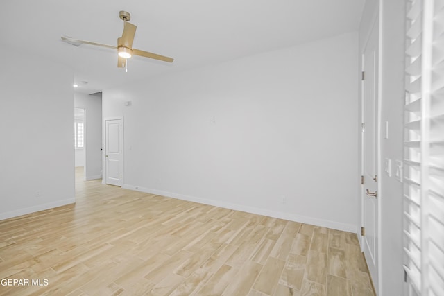 unfurnished room with ceiling fan and light hardwood / wood-style floors